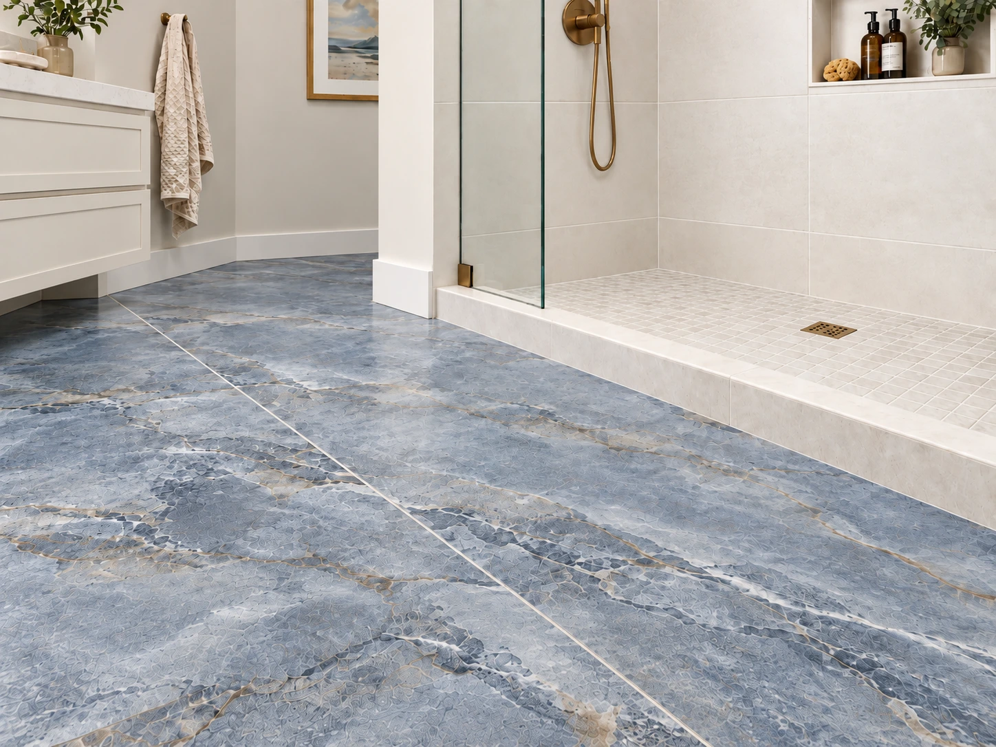 large-format bathroom floor tile transitioning to smaller shower-floor mosaic